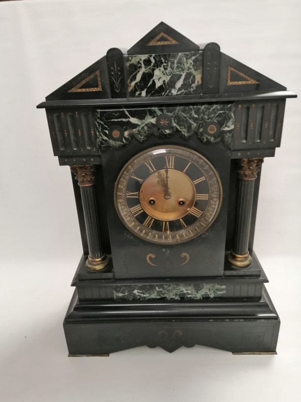 A late 19th Century French slate clock of architectural form, with Corinthian columns and engraved