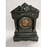 A late 19th Century French slate clock of architectural form, with Corinthian columns and engraved