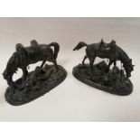 A pair of 20th Century cast metal figures of cavalry soldiers on the battlefield depending upon