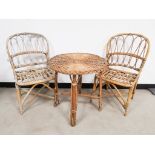 Pair of wicker cane chairs, together with a similar style circular table, 61cm diameter x 64cm H. (