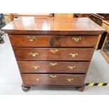 An antique walnut chest, of two short over three long drawers, cross banded top, solid sides, top