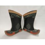 A pair of Mongolian boots, in tan, black and orange with traditional upturned toes and stitched
