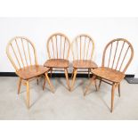 Set of four mid 20th Century beech and elm hoop back Windsor side chairs, possibly Ercol, debossed