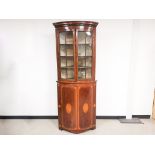 Edwardian mahogany glazed corner cupboard, with decorative border and central inlay, split glazed