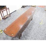 An 18th Century style mahogany oval gate leg coffin or wake table, double gate leg action with