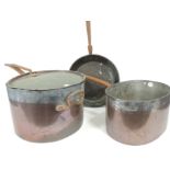 A group of three 19th century Victorian country house kitchen copper saucepans, each with