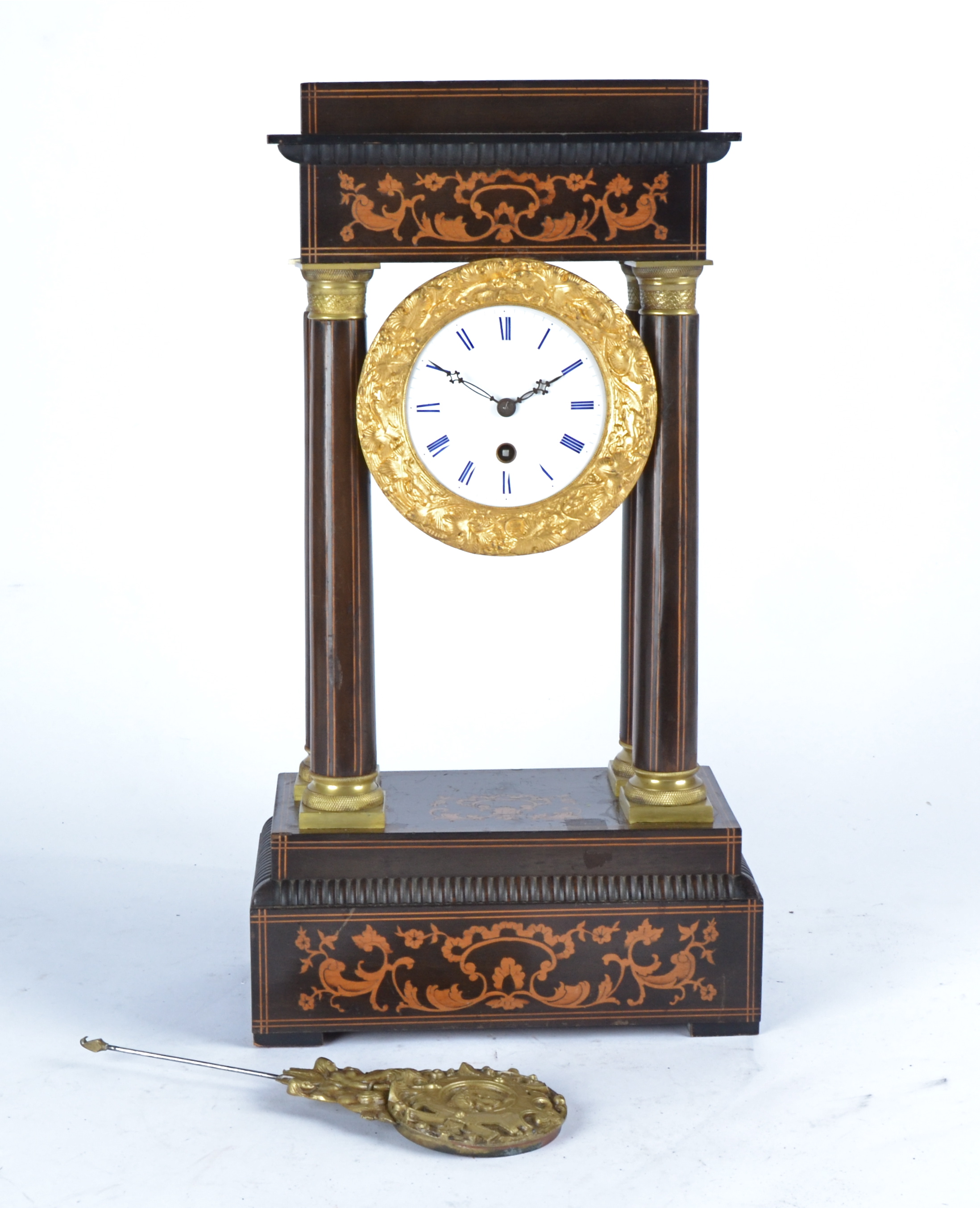 A 19th Century French ebonised wood ormolu four pillar portico clock, on plinth base, white enamel