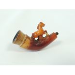 A late 19th or early 20th Century cheroot holder with figural decoration of a horse, in original