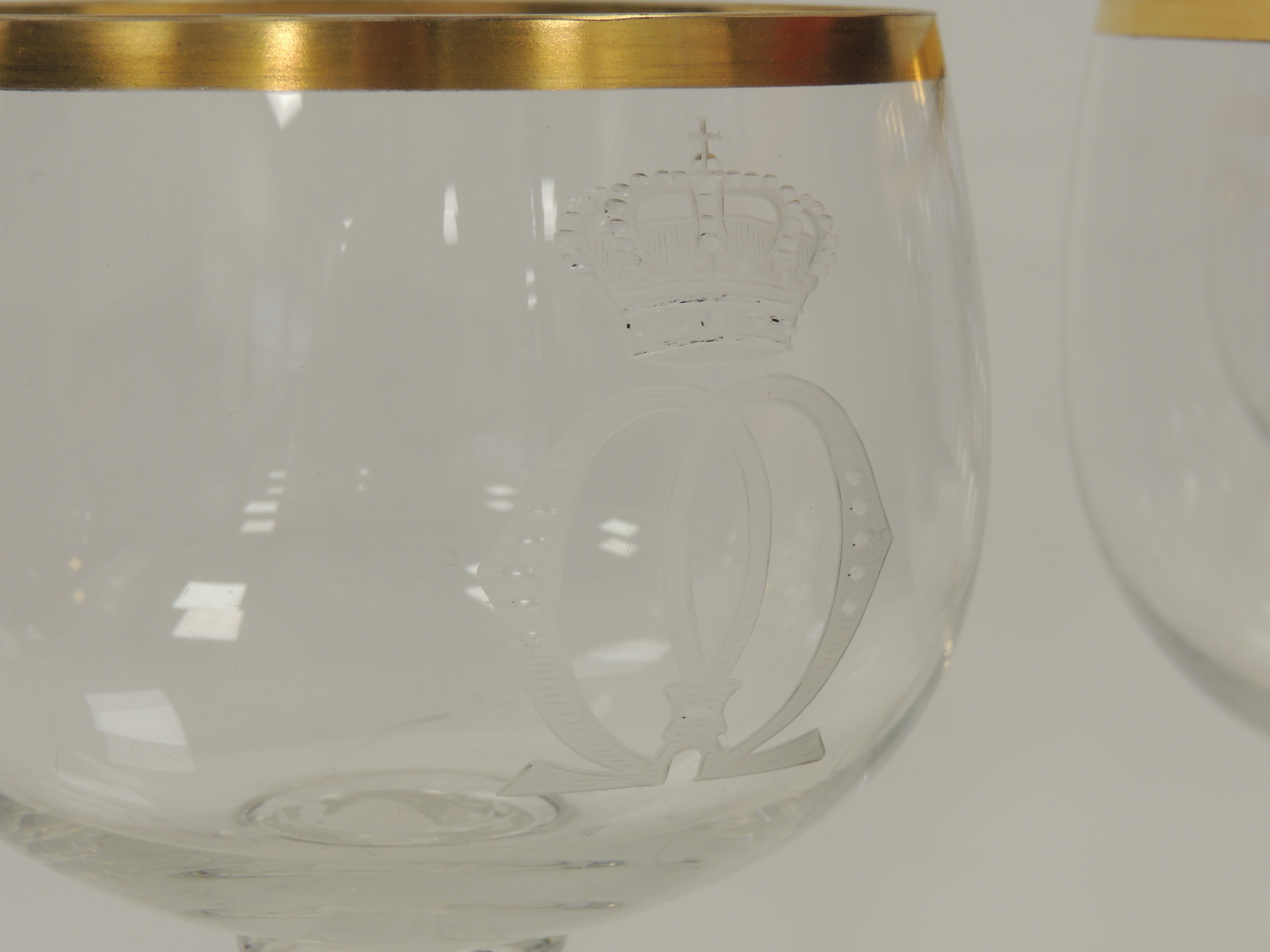 Four German glasses with engraved interlaced decoration surmounted by crowns, raised on multifaceted - Image 2 of 3