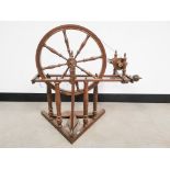 20th Century oak spinning wheel, 73cm W x 70cm H x 40cm D.