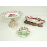 A small group of three pieces of English porcelain with floral designs, an inkstand of scrolling