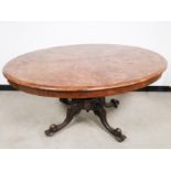 19th Century burr walnut oval tilt top loo table, with inlay decoration and set on a four legged