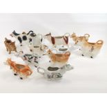 A ceramic cow creamer collection, to include a blue and white example by Burleigh in the 'Asiatic
