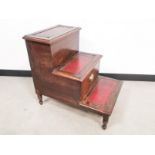 Mahogany leather topped library step, with central pull out storage compartment.