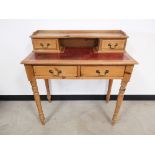 Waxed pine leather topped writing desk or dressing table, with two small drawers flanking a