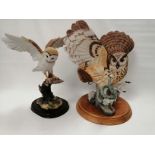 A Franklin Mint bisque porcelain figure of an owl confronting a snake, the base with factory