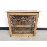 Waxed pine storage cupboard, with art nouveau style stained glass door to front, two internal