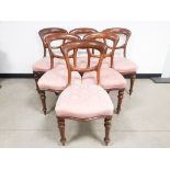 Set of six mahogany balloon back dining chairs, with pink upholstered seats on turned legs. 49cm W x