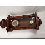 A 20th Century Vienna style mahogany wall clock, with brass dial, enamel chapter and Roman numerals,
