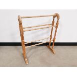 Pine towel rail, having five rails on turned frame, 63cm W x 30cm W x 78cm H.