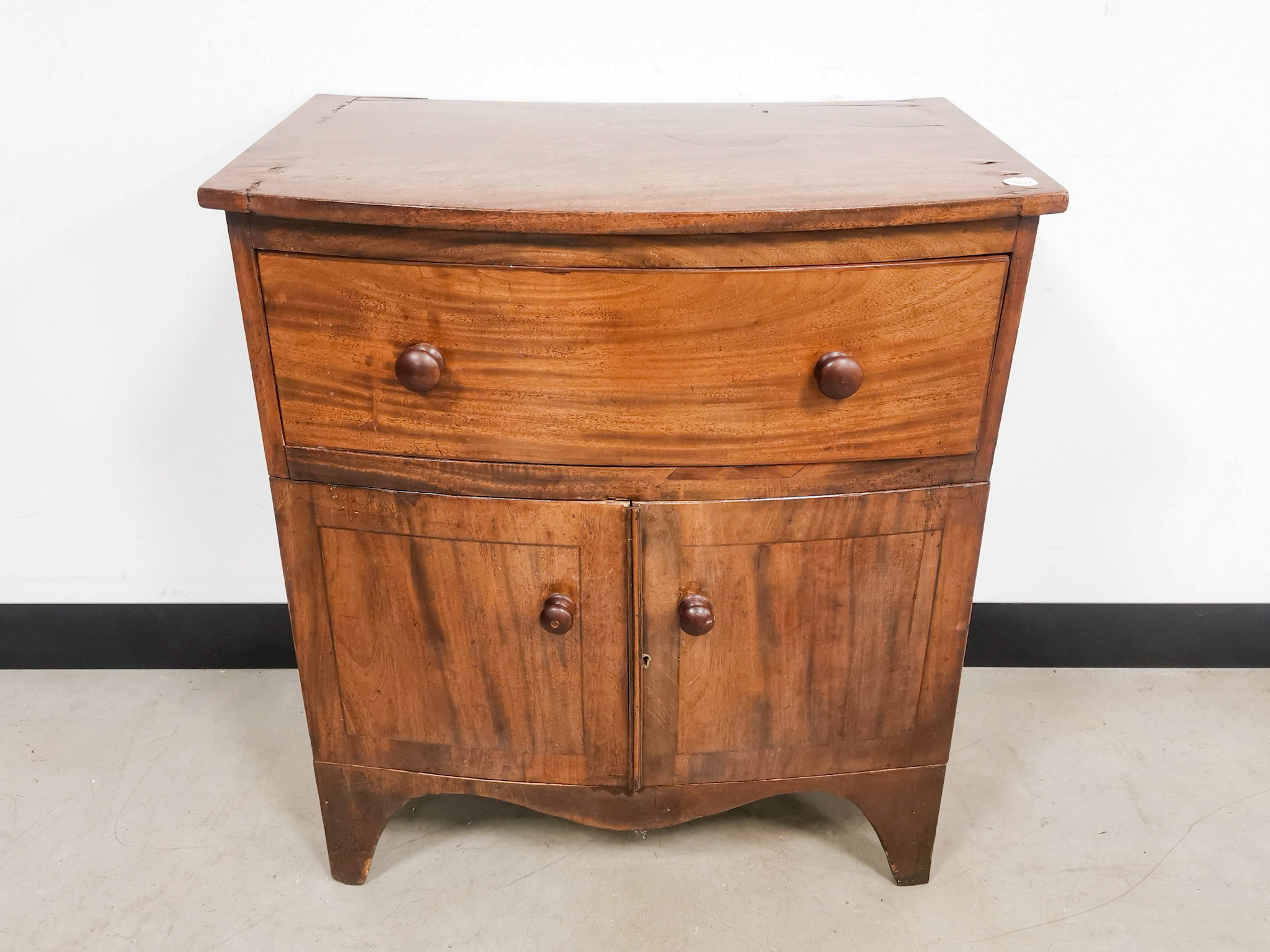 A small mahogany storage cupboard,