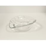 A 20th Century Baccarat glass dish of near oval shape, with impressions to the rim, the base with