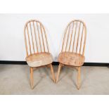 A pair of mid century Ercol quaker style chairs, with marking and wear to both.