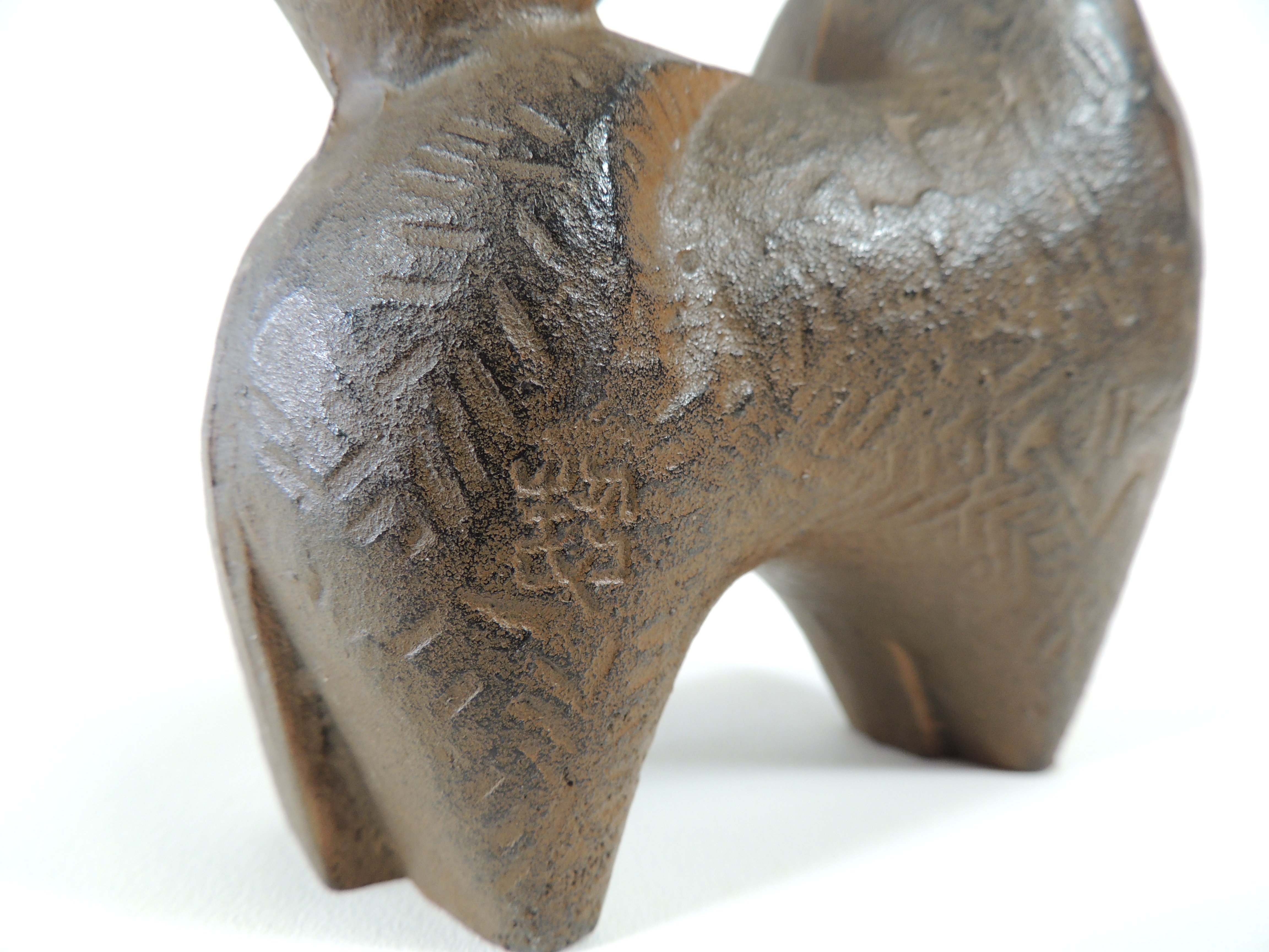 A 20th Century cast metal figure of a Pomeranian type dog, with impressed foundry mark to bag - Image 4 of 4