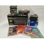 A boxed Sinclair ZX Spectrum Personal Computer, together with a quantity of boxed and cased