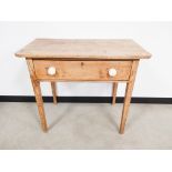 Worn pine side table, with single frieze drawer on tapered legs, 91cm W x 49cm D x 78cm H.