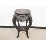Black lacquered oriental style carved jardinière stand, with painted dragon detailing to the top.