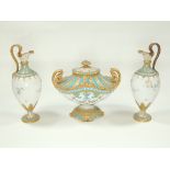 A Royal Crown Derby garniture comprised of a covered pot and two urns, all with embellished git