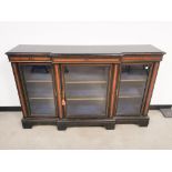 Victorian ebonised breakfront credenza, inlaid with burr walnut detailing, three glazed doors, and