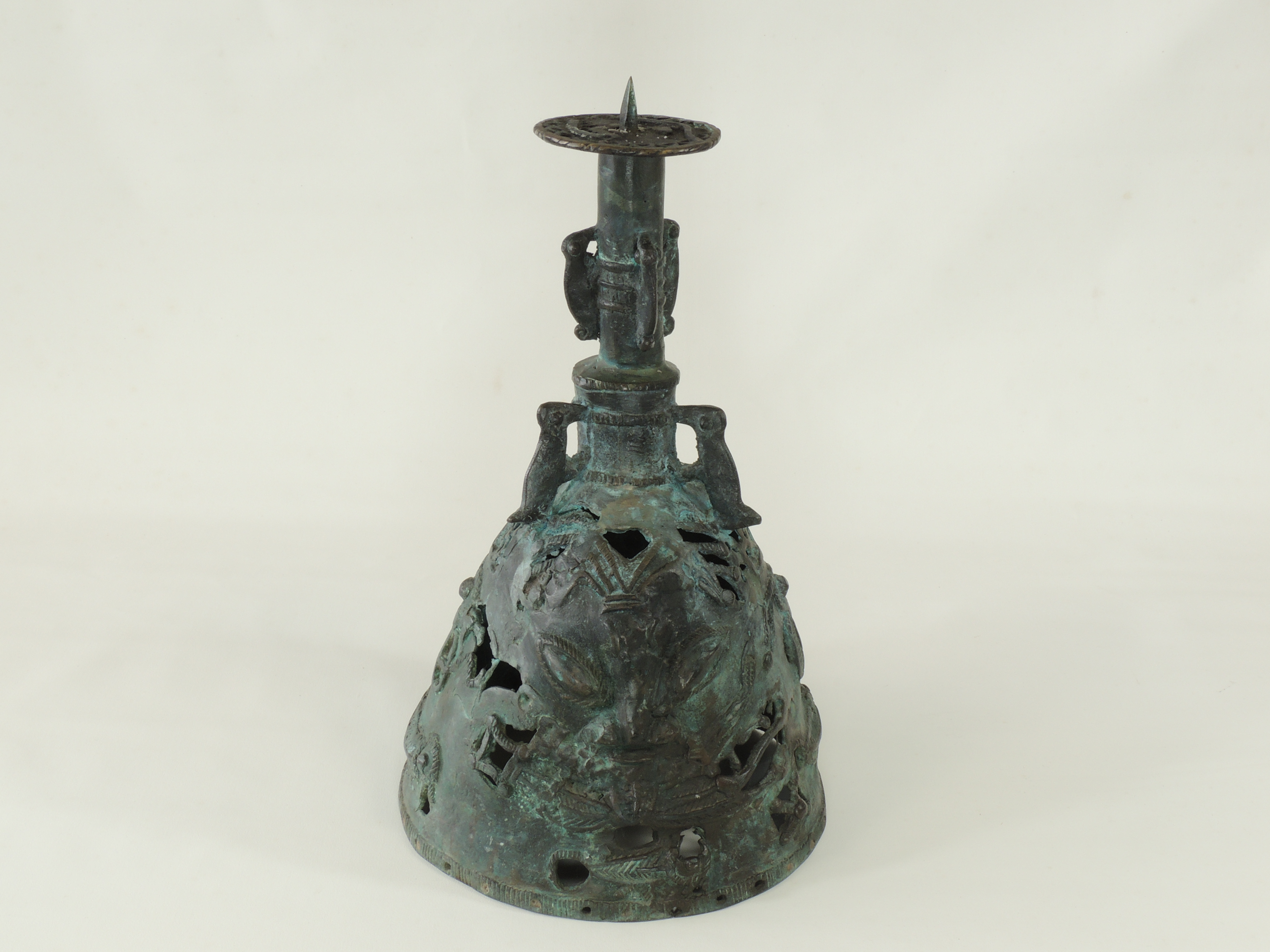 A Benin bronze style bell, with three handles in the form of mythical creatures, twin mask faces and - Image 2 of 5