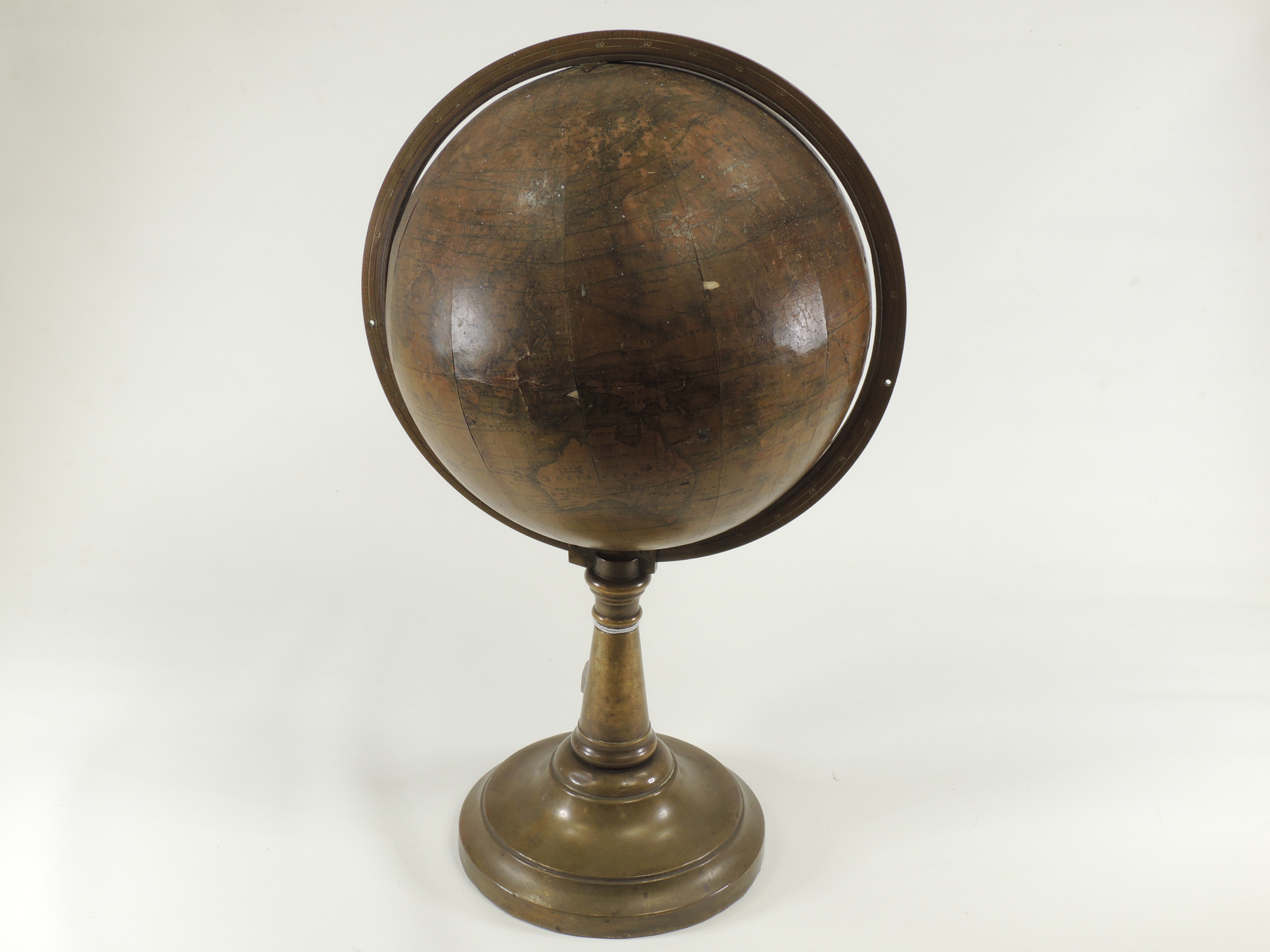 A Victorian terrestrial globe dating between 1840 and 1852, with brass bracket and stand,