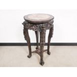 Oriental heavily carved hardwood jardinière stand, with shaped marble insert and carved beaded