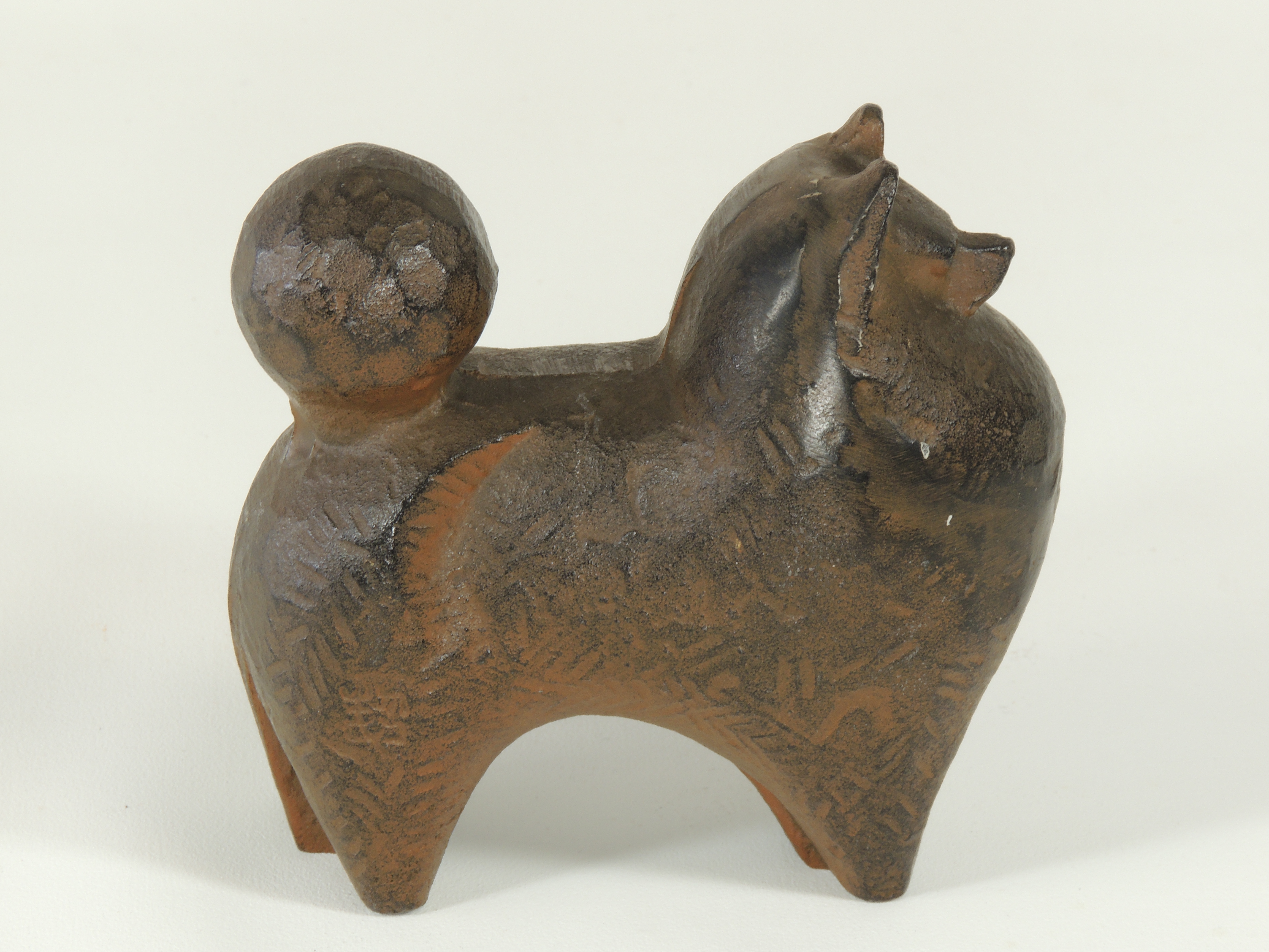 A 20th Century cast metal figure of a Pomeranian type dog, with impressed foundry mark to bag - Image 2 of 4