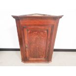 Edwardian mahogany corner cupboard, with inlaid cornucopia and surrounding decoration, 57cm W x 57cm