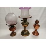 Three early 20th Century cooper and brass British oil lamps the tallest from 'The Albion Lamp