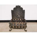 Wrought iron fire basket, together with a cast iron plaque with embossed bird and surrounding