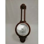A 20th Century mahogany banjo barometer by 'Shortland Smiths', with two carved acanthus type motifs,