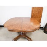 20th Century extending oak dining table, with single pedestal support, together with additional leaf