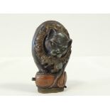 A late 19th or early 20th Century novelty brass vesta case, taking the form of a cat clenching a