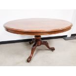 A 19th Century mahogany oval tilt top table, with carved tripod base. 127cm x 105cm x 67cm