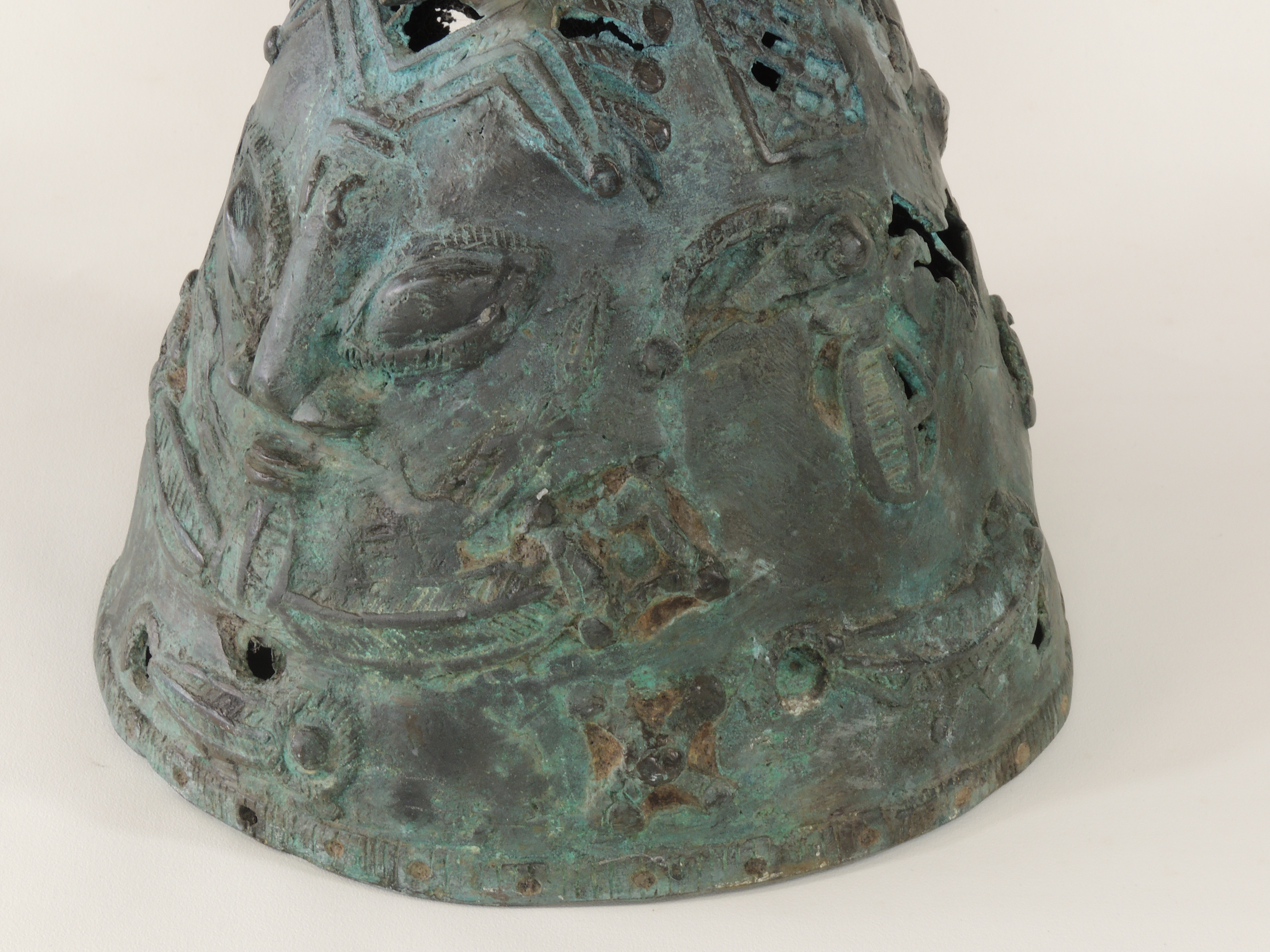 A Benin bronze style bell, with three handles in the form of mythical creatures, twin mask faces and - Image 5 of 5