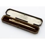 An Art Deco Bakers Pointer 9ct gold propelling pencil, with inscription dated 1936 in case, total