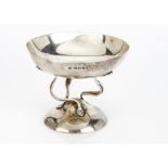 An Edwardian small silver comport from Alexander Clark & Co, the Arts & Crafts dish having
