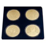 A Pobjoy Mint four silver gilt coin set, titled "Royal Salute 1977" on the certificate, in fitted