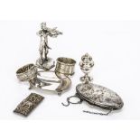 Seven items of silver and white metal, including an oval purse, dented, a small oval tray, two