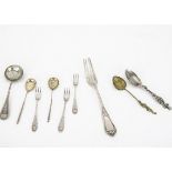 A late 19th Century Russian silver sifter spoon and other spoons and forks, including an America